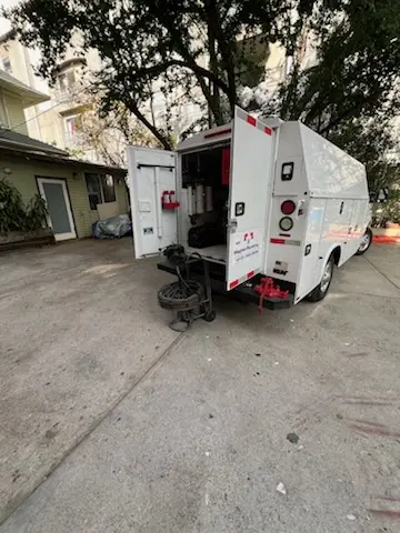 Magnet Plumbing service vehicle on-site for Grease Trap Cleaning in Christopher Columbus Homes